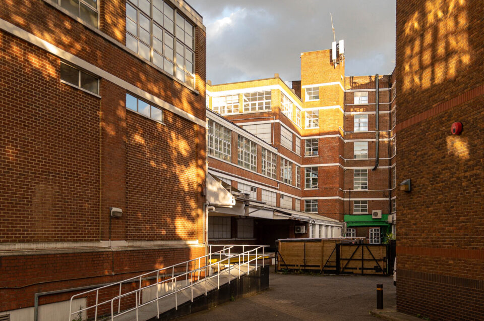 Exterior of a modern brick industrial complex.