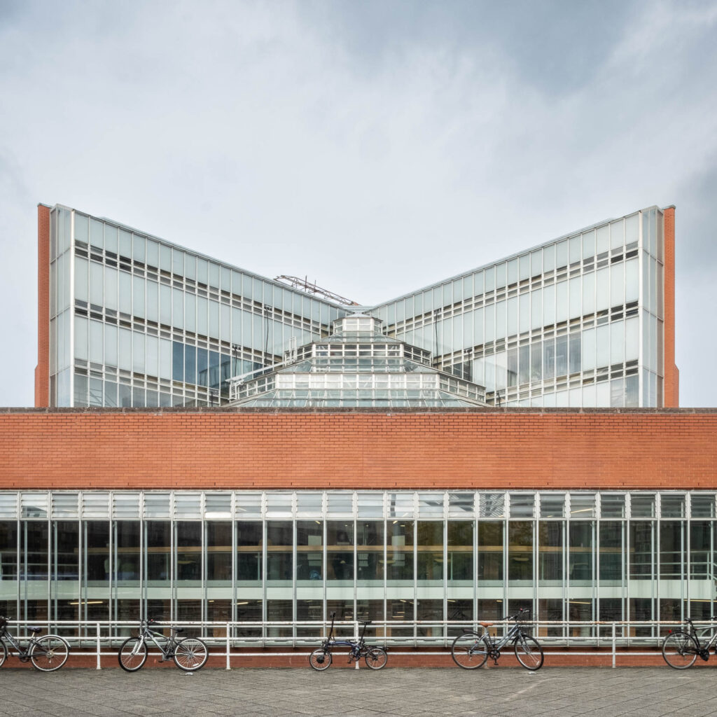 Exterior of a brick and glass modernist library.