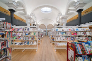 Interior of a neoclassical library with vaulted ceilings.